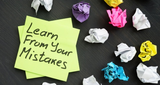 Crumpled sticky notes reflect learning from your mistakes