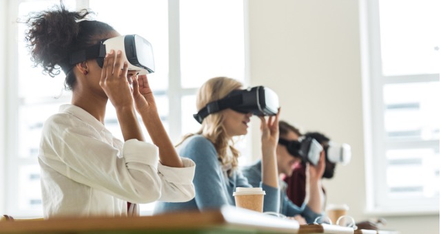 Students wear virtual reality technology in college classroom
