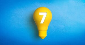 Yellow lightbulb with number seven on it
