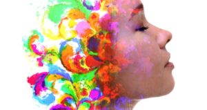 Woman's brain side is filled with colors and imagination