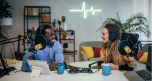Two people doing a podcast in a studio