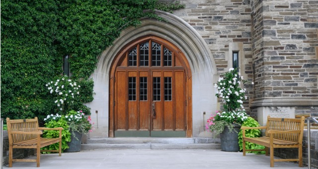 Double wooden doors to a college building