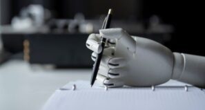 Robot hand writing a paper