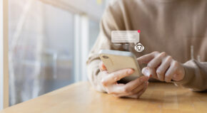 close up young businessman hand hold smartphone and use AI application program prompt to ask or research or request deep information for business and future of machine learning and lifestyle concept