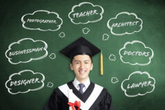 smiling graduation thinking about different jobs concepts