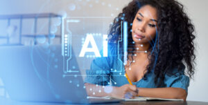 Female student writing in notebook near laptop, holographic AI circuit elements overlay, indoor scene. Concept of artificial intelligence learning