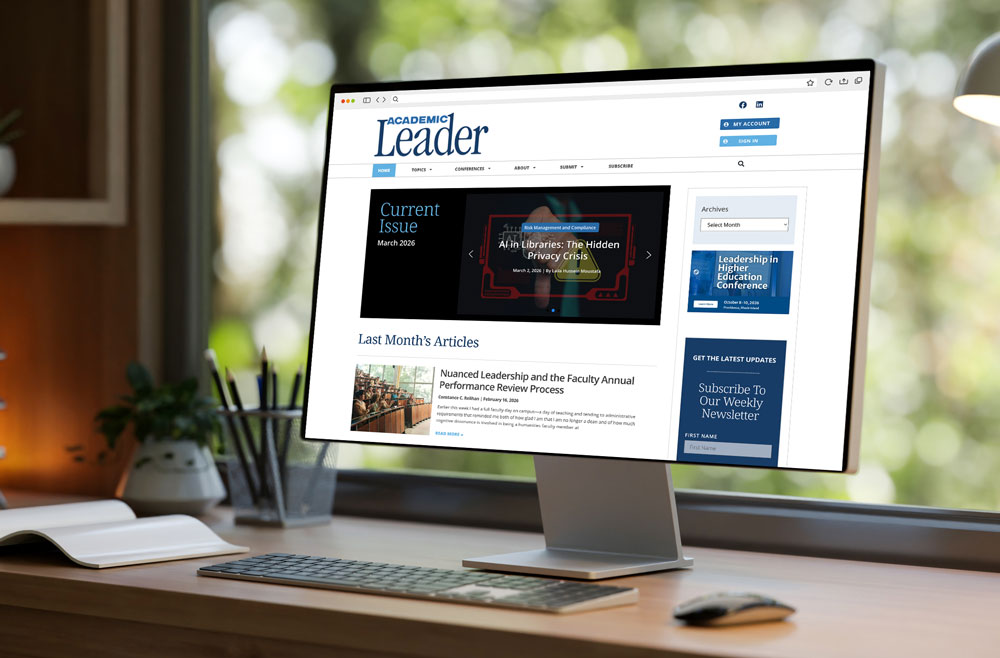 Computer showcasing the Academic Leader homepage on the screen