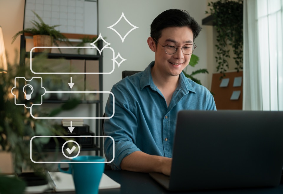 Student smiling at computer with icons overlayed