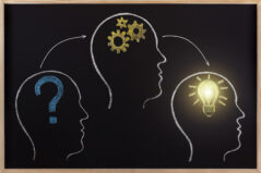 Critical thinking concept. Black chalkboard human head process occurs brainstorm.