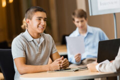 High school student being interviewd by college advisor or recruiter