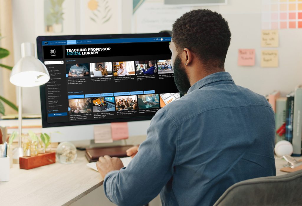 Man sitting at computer with the Teaching Professor Digital Library showing on the screen